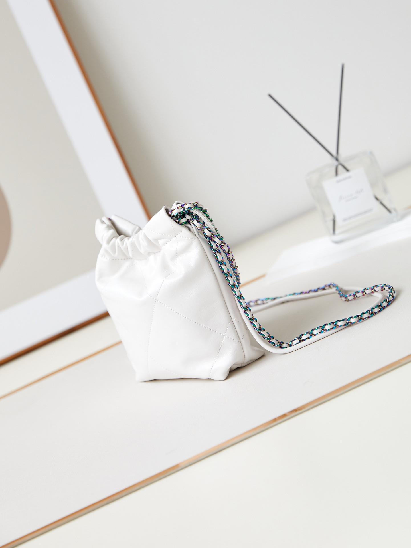 CHANEL 22 MINI HANDBAG Shiny Calfskin & Rainbow Metal White 7.8 × 7.4 × 2.3 in